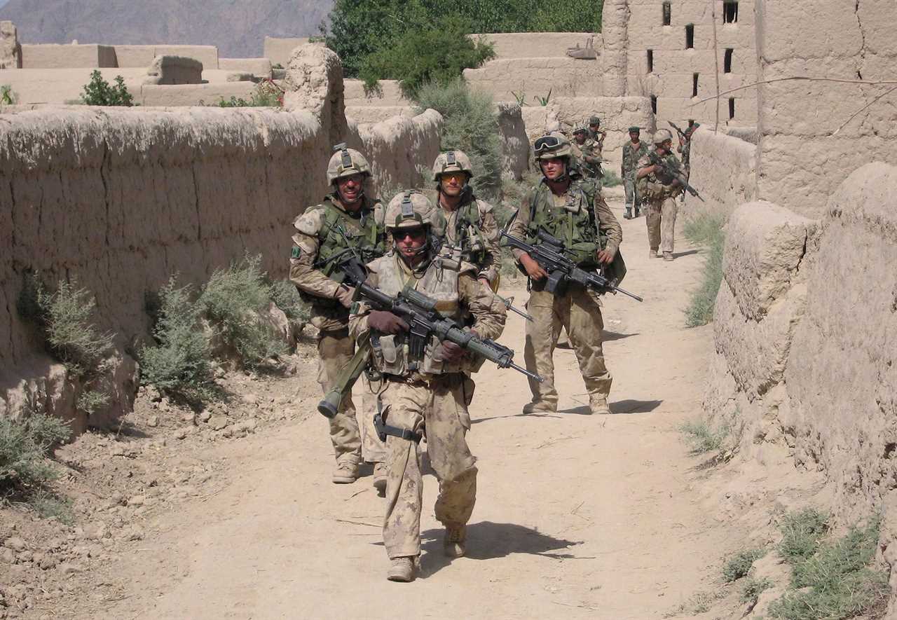 Canadian troops patrol the Afghan village of Zangadin on June 14, 2006 (John Cotter/CP)