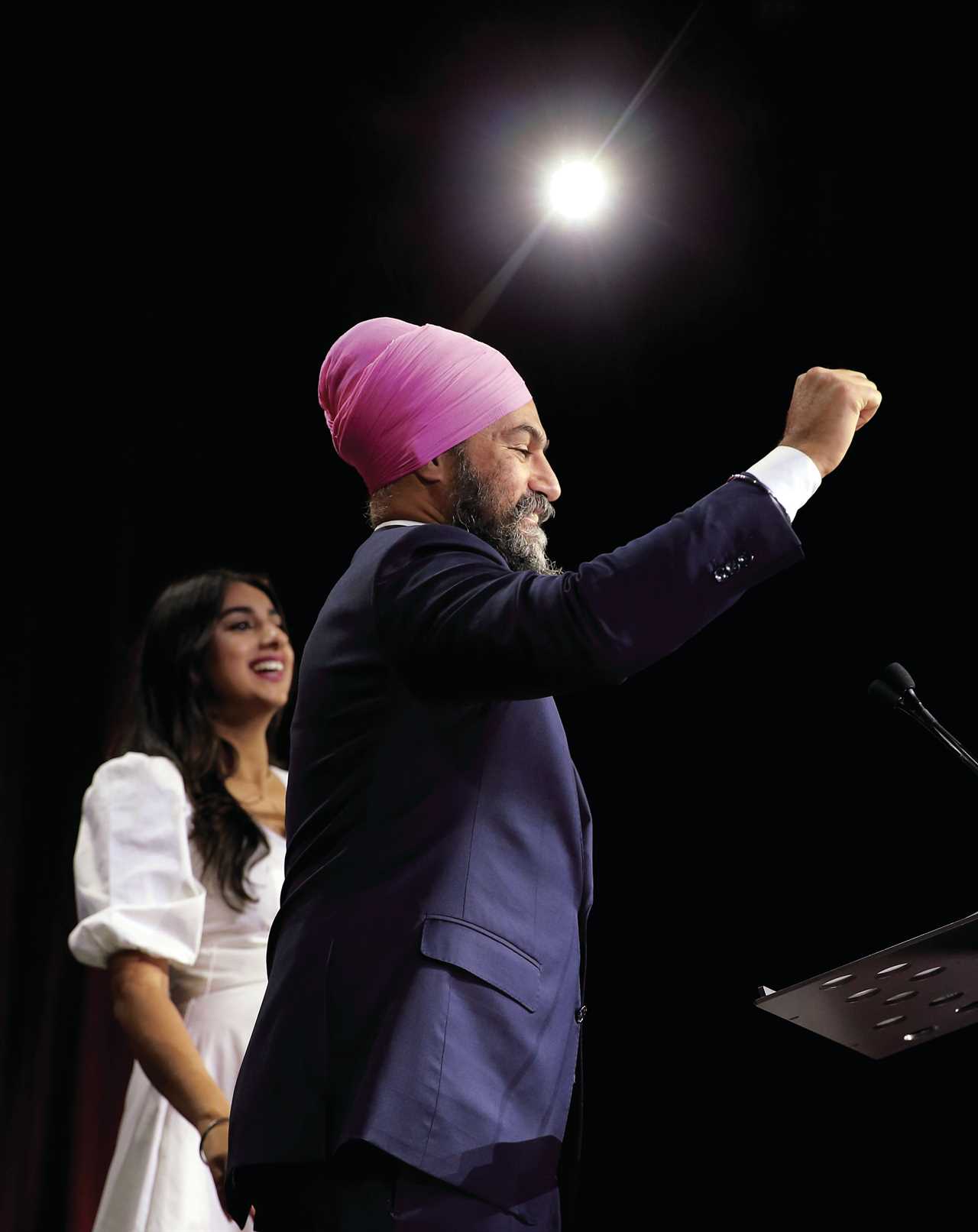 New Democratic Party Leader Jagmeet Singh stands with his wife Gurkiran Kaur Sidhu as he delivers remarks at an election night event on September 20, 2021 in Vancouver, Canada. For the first time in a decade, the New Democratic Party will have more seats in parliament than they had at the start of the election, picking up an additional three seats for a projected total of 27. (Jeff Vinnick/Getty Images)