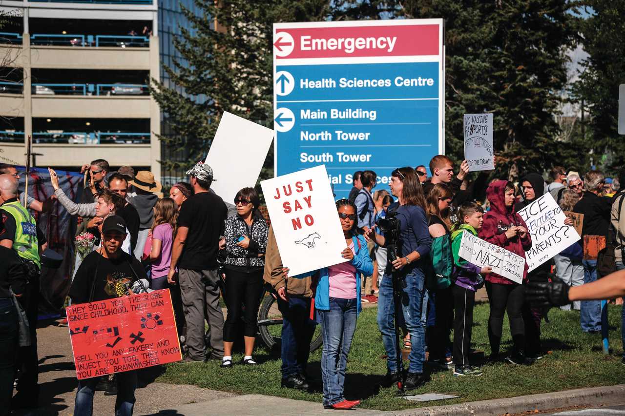 Protesters gather at the Foothills Hospital to oppose COVID-19 related public health measures in Calgary, Alta., Monday, Sept. 13, 2021. (Jeff McIntosh/CP)