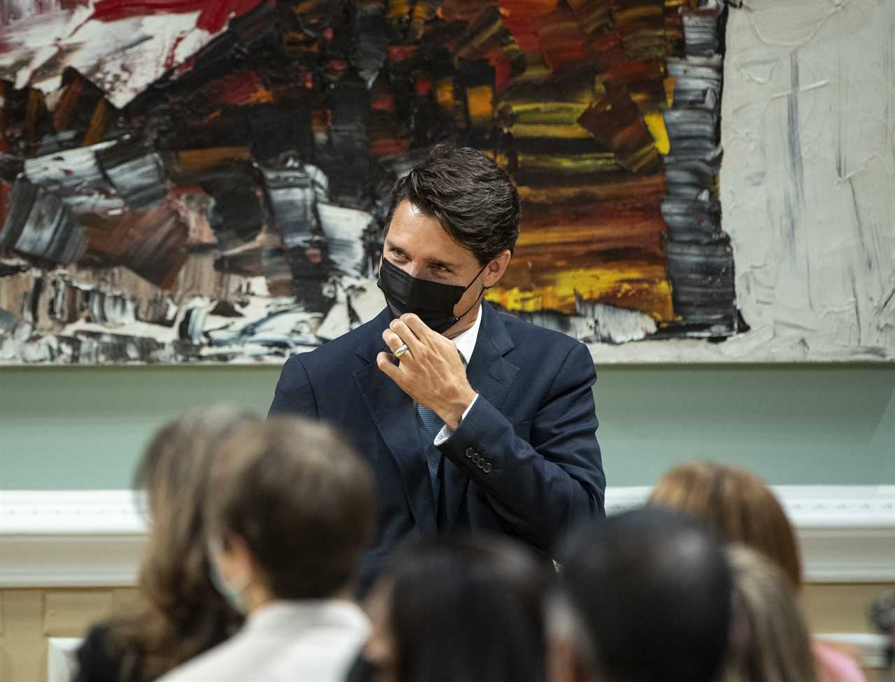 Trudeau adjusts his mask during a Cabinet swearing in ceremony at Rideau Hall in Ottawa, on Oct. 26, 2021 (Justin Tang/CP)