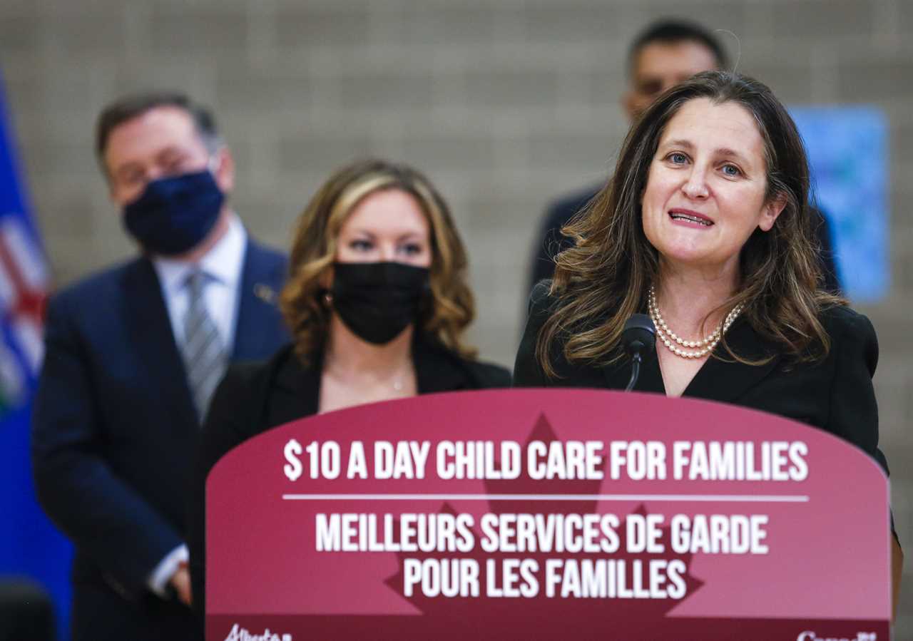 Freeland makes a child care announcement as Alberta Premier Jason Kenney looks on in Edmonton on Nov. 15, 2021 (Jeff McIntosh/CP)