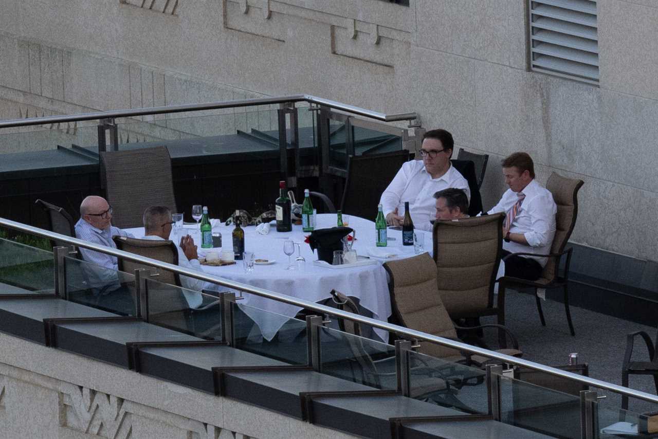 Premier Jason Kenney (bottom right) and key cabinet ministers on a patio in the Federal Building in Edmonton. Among the group are Environment and Parks Minister Jason Nixon (top right), Health Minister Tyler Shandro (far right). (@TheBreakdownAB /Twitter)