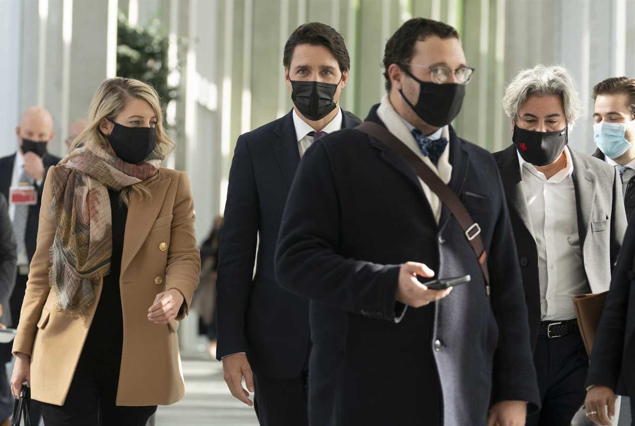 Trudeau walks with Joly and Minister of Heritage Pablo Rodriguez as they leave a cabinet meeting, in Ottawa, on Oct. 27, 2021 (Adrian Wyld/CP)