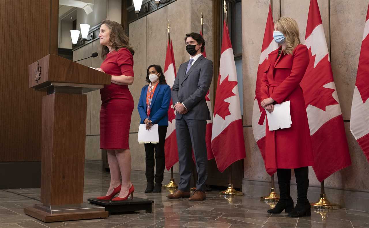 Anand, Trudeau and Joly listen to Freeland speak during a media availability following a cabinet retreat, on Jan. 26, 2022 (Adrian Wyld/CP)