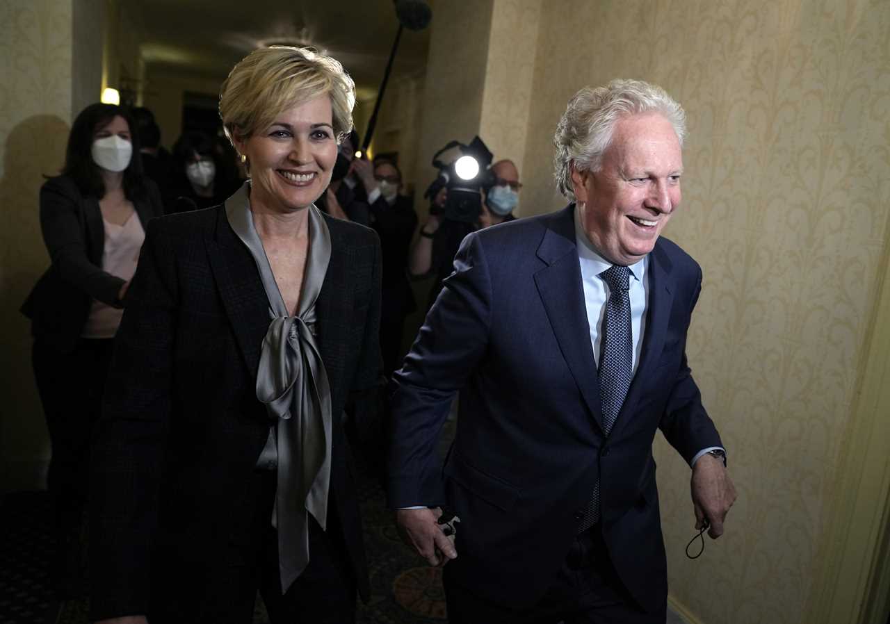 Charest arrives with his wife Michele Dionne for an event with potential caucus supporters, in Ottawa, March 2, 2022. (Justin Tang/The Canadian Press)