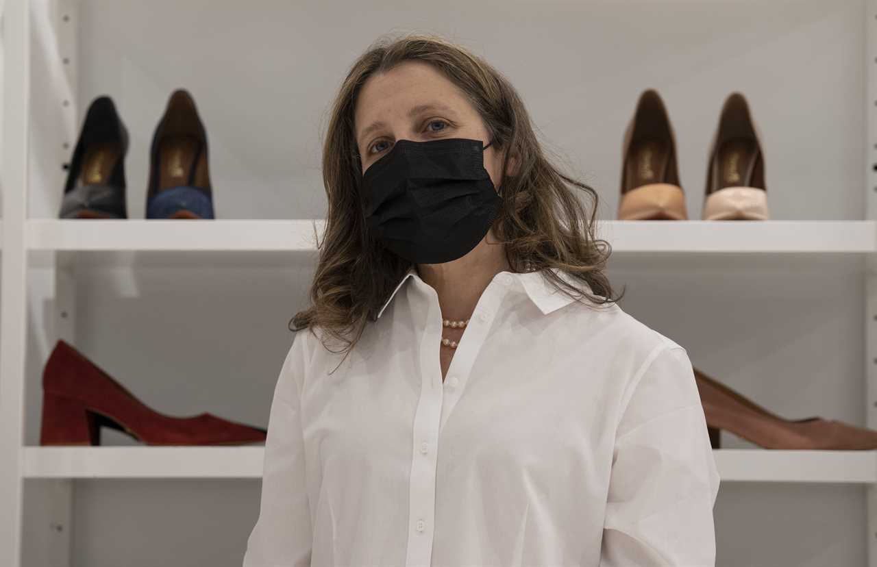 Finance Minister Chrystia Freeland speaks with the media after purchasing a new pair of shoes at a local shop, April 6, 2022, in Ottawa. (Adrian Wyld/The Canadian Press)