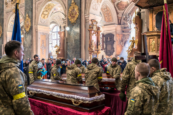 A funeral for three Ukrainian soldiers in March in Lviv.