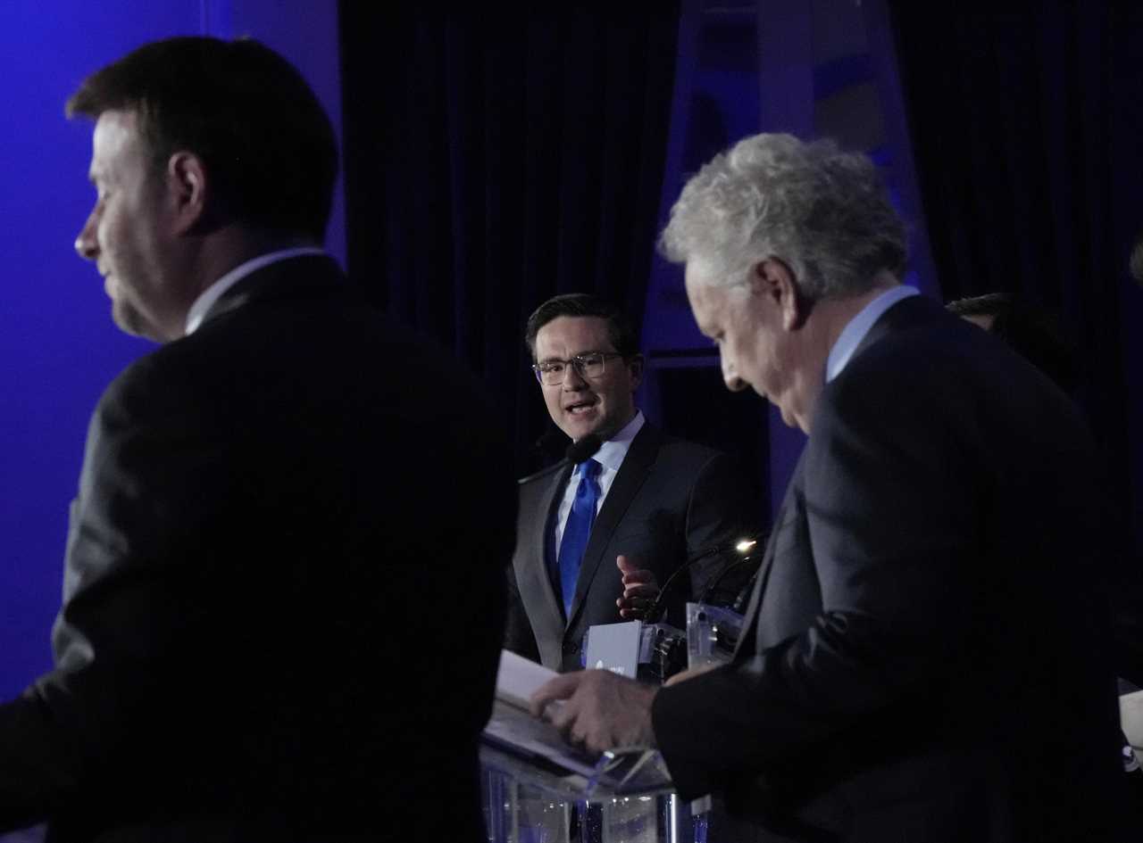 Candidates Roman Baber, left, Pierre Poilievre and Jean Charest, right, take part in the French language Conservative Leadership debate Wednesday, May 25, 2022 in Laval, Que. (Ryan Remiorz/The Canadian Press)